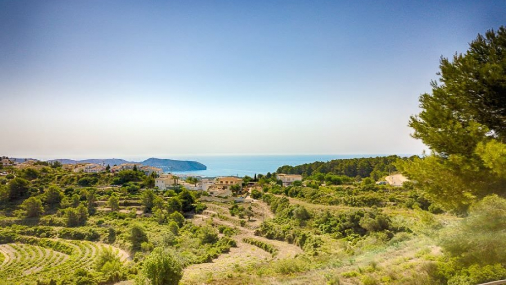 Amazing Ibiza style villa on the edge of Moraira with stunning sea and vineyards views